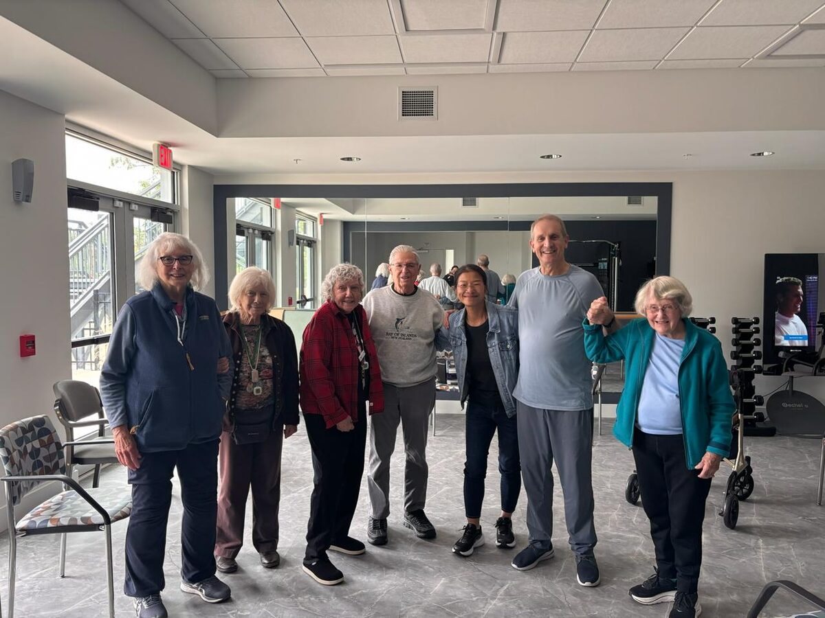 Orion instructor with residents in a community fitness room