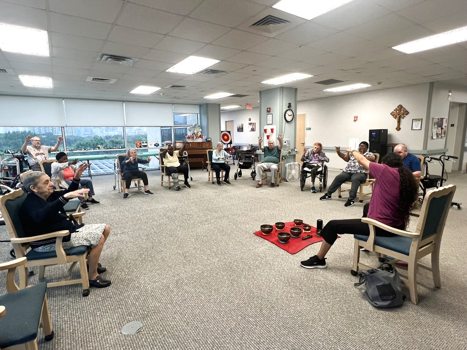 Residents taking part in a group Chair Fitness class